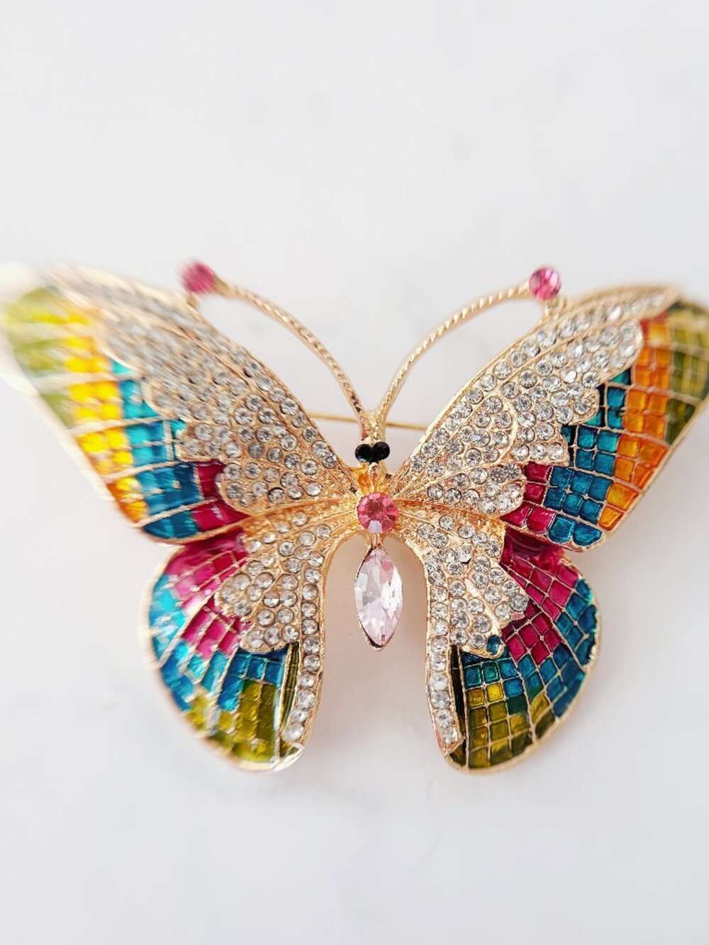 Colorful Rhinestone Butterfly Brooch with a Gold-Tone Finish